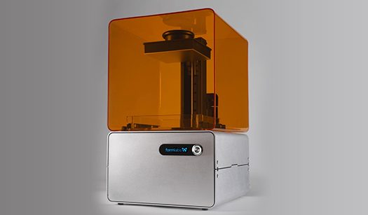 Formlabs desktop 3D printer with an orange resin cover